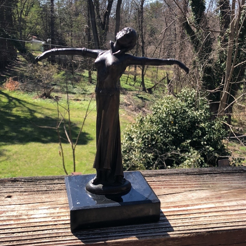 Vintage bronze statue of woman with outstanding arms